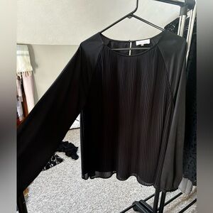Black ruffled blouse.
